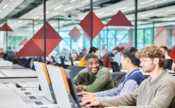 Some students chatting in a computer lab.